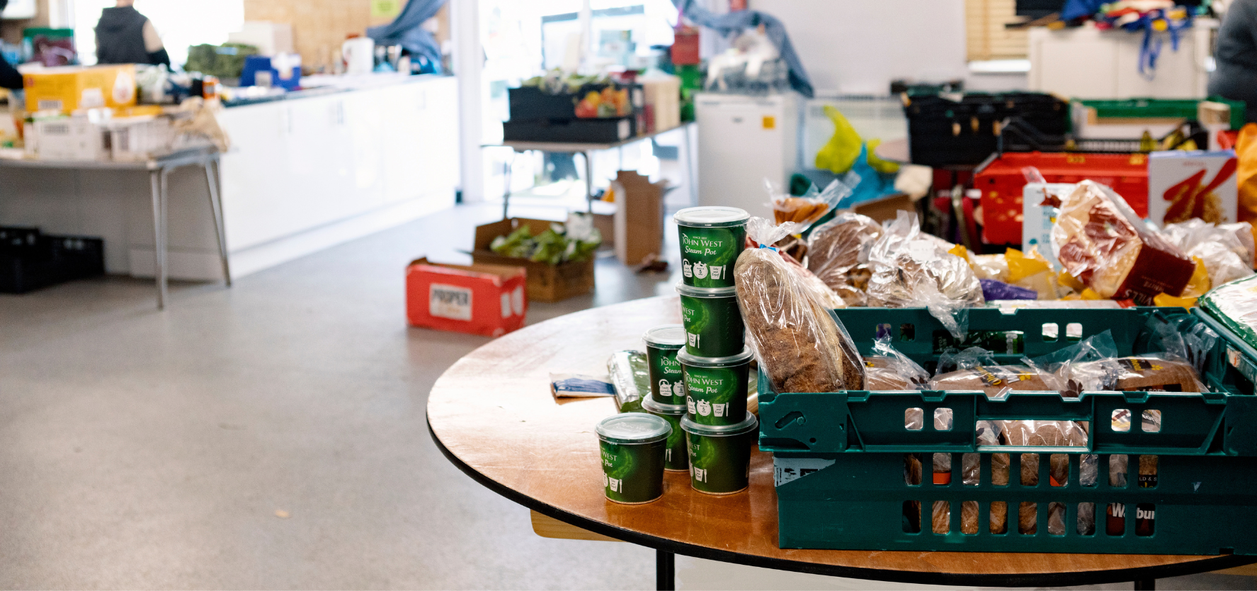 A table with a crate of food on top, ready for a co-op to meet.