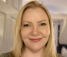 A photo of Andrea smiling at the camera
